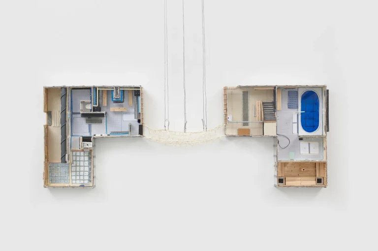 Downstairs (Bridged), 2021. Corrugated cardboard, hot glue, archival glue, coloured acetate, grid sticker, construction paper, plastic straw, grid paper, string, sequins, glass beads, popsicle sticks, rhinestones, stones, window mesh, acrylic paint, bus transfer, inkjet print on paper, plastic straw, plastic bobby pin, tissue paper, sand paper, glitter, sand, Canadian quarters, leather, cork, metallic thread, thread, stir sticks, duo-tang cover, aluminum tape, faux fur, soap, bristol board, gimp, cardboard tube, magazine cutouts, sticky note, marker, brass stud, pipe cleaner, gaffer tape, glass mirror tiles, plasticized canvas, bread tab, wire, mat board, felt, muslin, PVC tube, push pins. Courtesy of the artist and Unit 17. Photo by Phoebe D’Heurle.